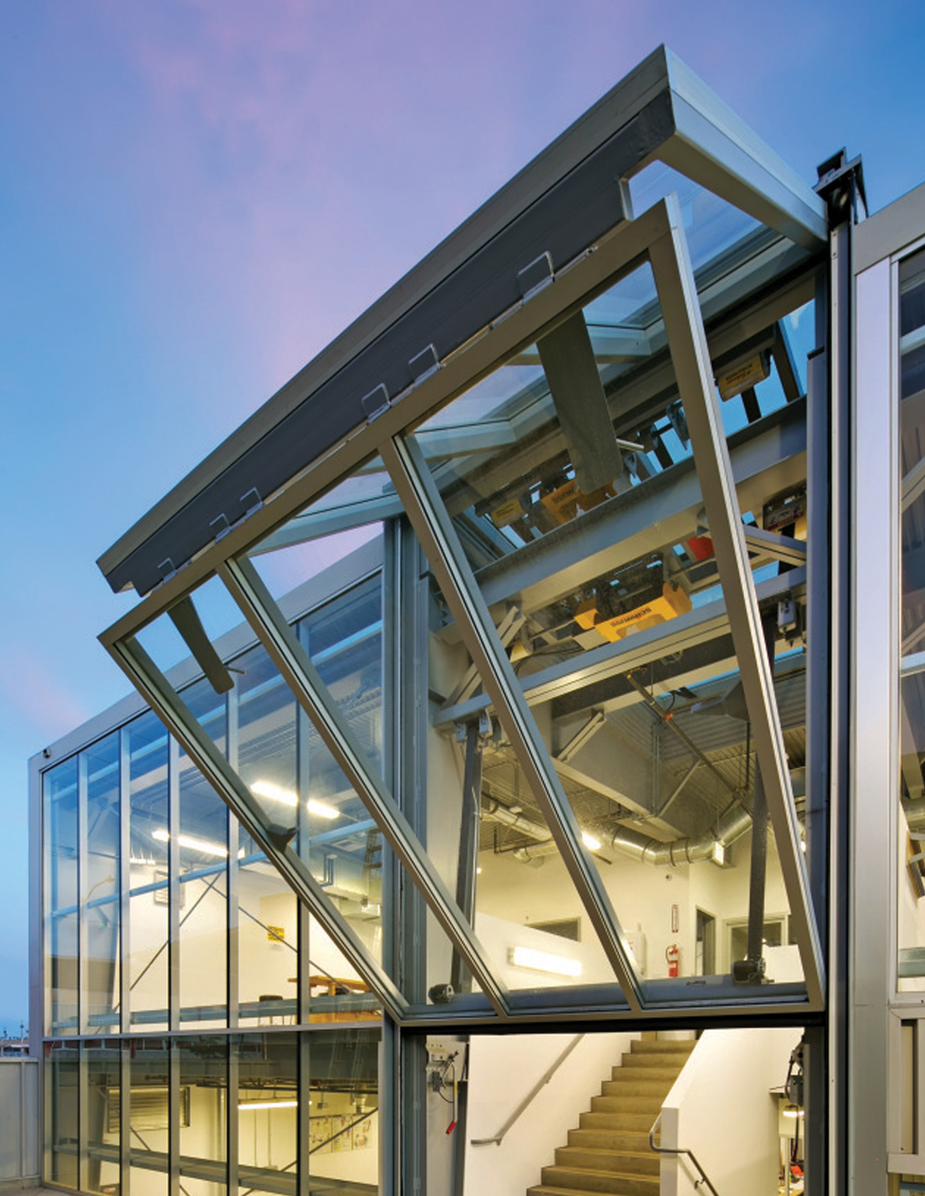angled view of  SCI-Arc Magic Box's glass-and-steel building with exposed framing and stairwell